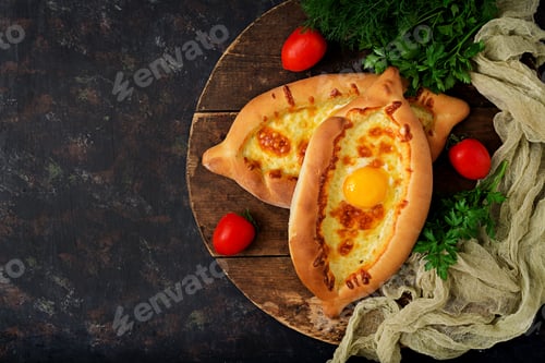 Preview: Khachapuri in Adjarian. Open pie with mozzarella and egg. Georgian cuisine.
