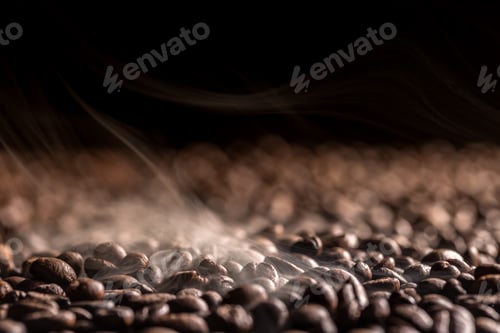 Roasted Coffee Beans and Steam on Black