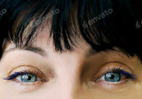 Preview: Blue eyes of woman, close up