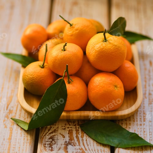 Preview: Tangerines with leaves on a rustic wooden background
