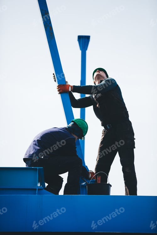 Preview: Manual workers working at shipyard construction site