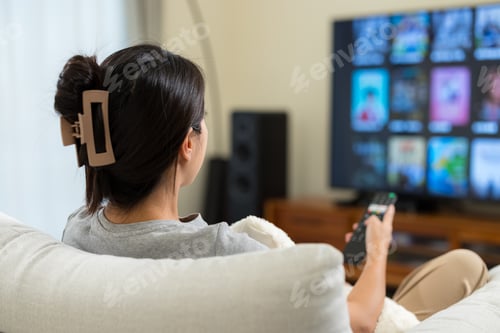 Preview: Woman watch TV at home