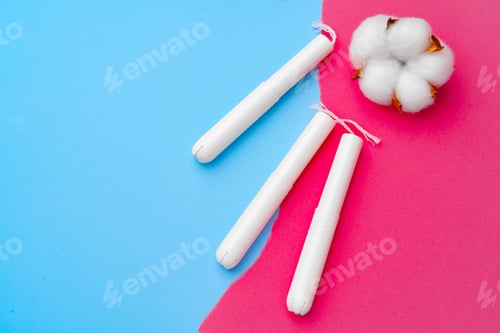 Preview: Female medical tampons on pink and blue background