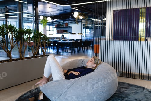 Preview: Caucasian woman chilling in a bean bag