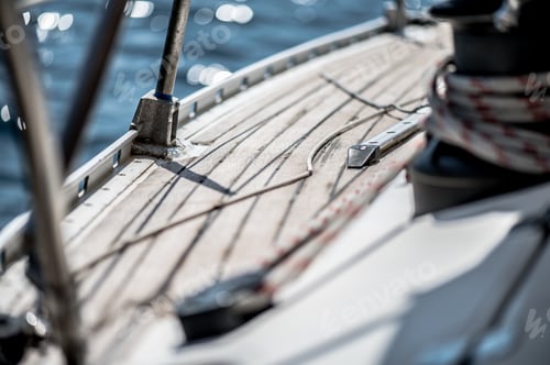 Preview: Close up shot of the wooden floor of ship floating in the sea during a sunny day