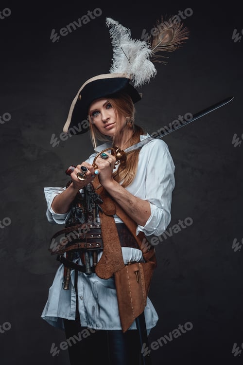 Preview: Studio shot of woman corsair with saber and guns