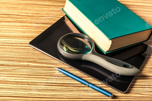 Preview: books and magnifying glass