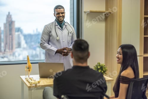 Preview: Orthopedic doctor with MRI result, upcoming surgery. Focus on rehabilitation for effective healing