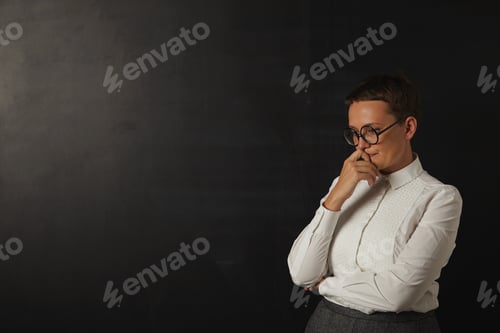 Preview: Teacher in white blouse at the blackboard