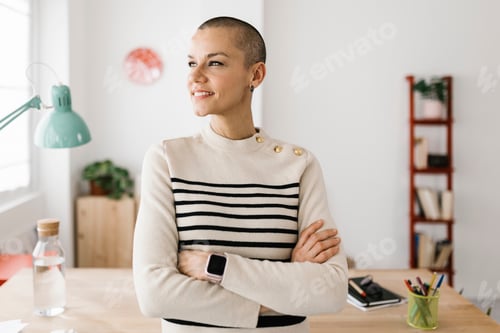 Preview: Successful portrait of mid adult businesswoman standing at office workplace