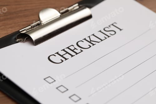 Preview: Clipboard with inscription Checklist on wooden table, closeup