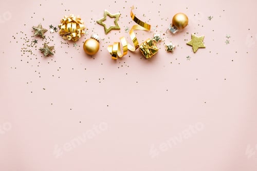 Preview: Flat lay of Celebration. Golden Christmas decorations on pink background