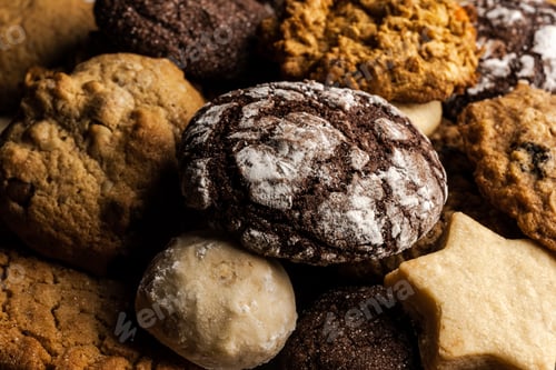 Preview: close up of christmas cookies, with chocolate, ginger, sugar, walnut, powdered sugar on wooden table