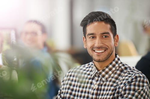 Preview: Visions of success. Cropped shot of a young businessman at his dek.