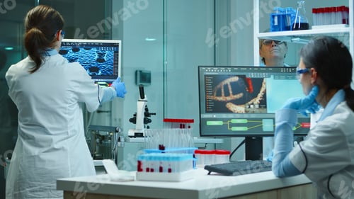 Preview: Scientists working overtime in chemical modern equipped laboratory