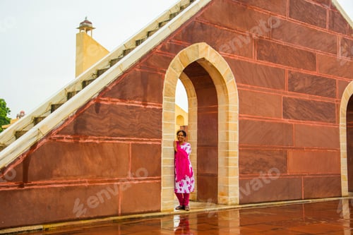 Preview: Woman tourist at the Jantar Mantar observatory, Jaipur, UNESCO World Heritage Site, India.