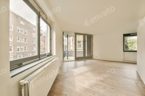 Preview: a living room with large windows and a wood floor