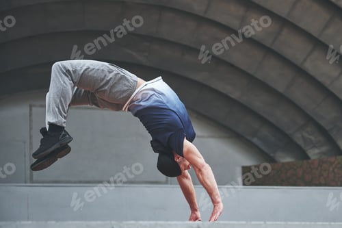 Preview: The man outdoors practices parkour, extreme acrobatics