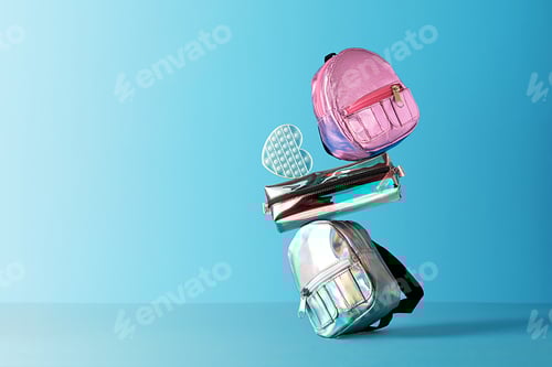 Preview: The creative concept of back to school. School supplies are balanced on a blue background.