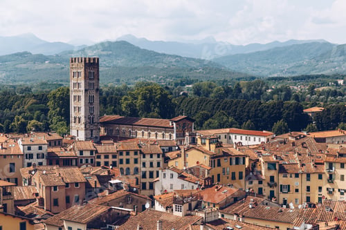 Preview: aerial view of roofs of ancient city and mountains, Pisa, Italy