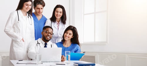 Preview: Multinational Group Of Doctors Looking In Laptop