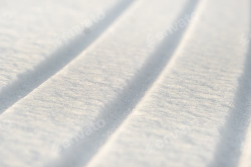 Preview: winter background. The texture of snow with stripes. Pure white snow