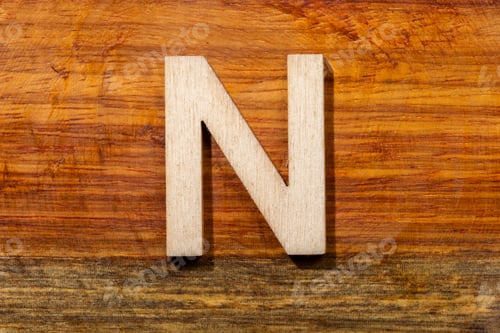 Preview: Wooden letters N on wooden background, top view