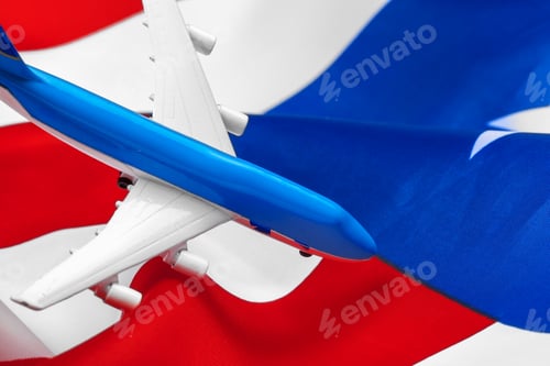 Preview: Plastic toy jet plane and flag of USA