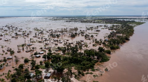 Preview: Big flood with trees and a village in the dirty waters in Africa