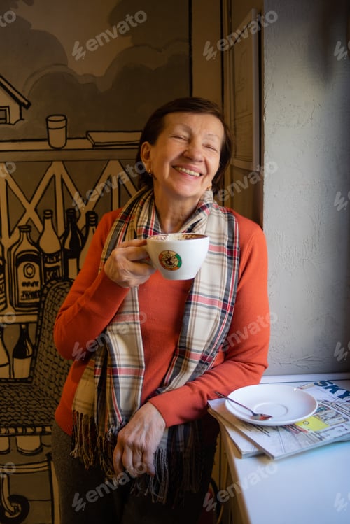 Preview: Senior woman is enjoying her coffee