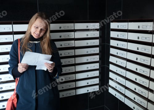Preview: Happy woman reading a letter