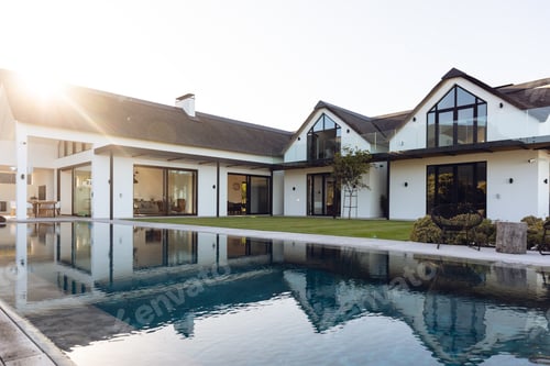 Preview: View of luxurious modern house exterior with garden and swimming pool