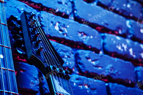 Preview: Guitar headstock with tuners on dark background