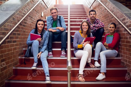 Preview: Group Portrait Of Young College Students Sitting On Stairs In The College