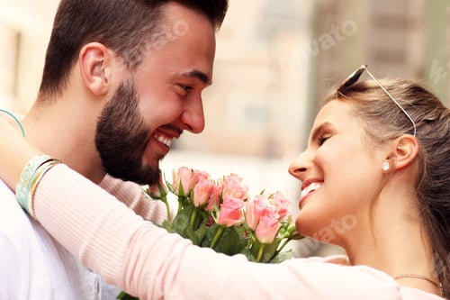 Preview: Young romantic couple with flowers