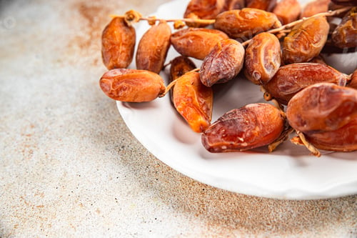 Preview: date on a branch dried sweet fruit fresh appetizer meal food snack on the table copy space food