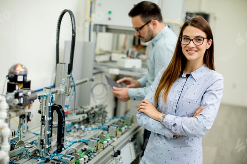 Preview: Young couple of students working at robotics lab