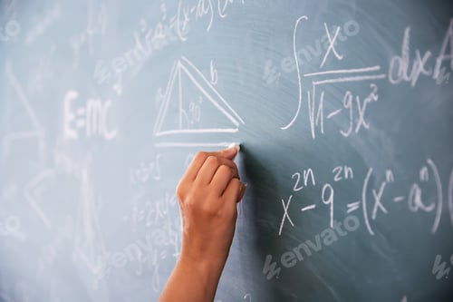 Preview: Teacher or student writing on blackboard during math lesson in school classroom