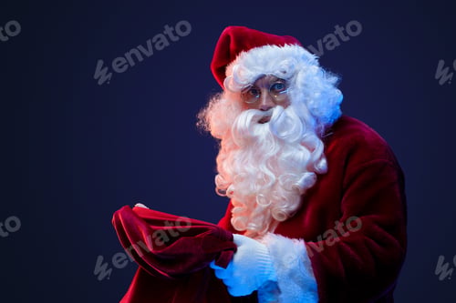 Preview: Santa with big bag and glasses looking at camera