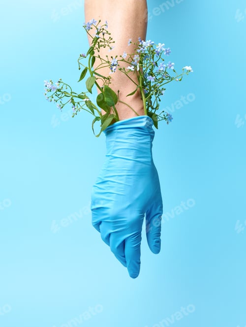 Preview: Doctor's Hand in Blue Gloves with Flowers for Health Worker or Nurse's Protection Concept