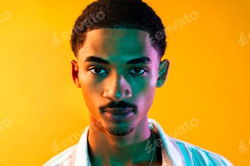 Preview: African man portrait in studio on colorful background