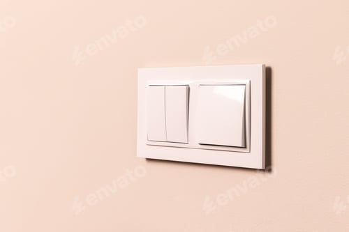 Preview: White electrical switches on beige wall