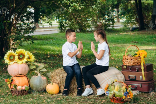 Preview: Boy and Girl Enjoying Autumn Day in the Park