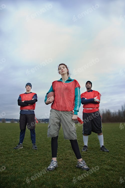 Preview: Mixed race members of a team of American football players.