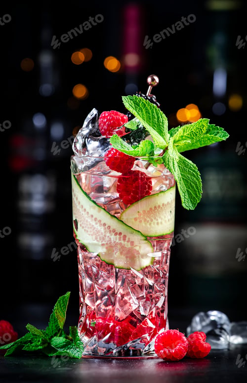 Preview: Rose garden alcoholic cocktail drink with dry gin, tonic, syrup, lychee, lemon, raspberry, cucumber