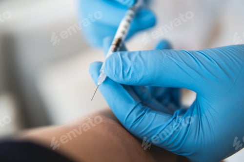 Preview: The doctor is injecting close up