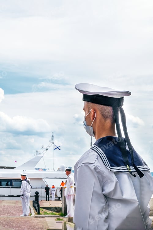 Preview: Young sailor in full dress uniform and medical mask