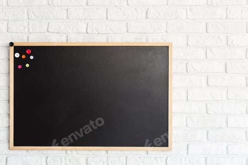 Preview: Blackboard hanging on brick wall