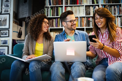 Preview: Group of college students studying in the school library