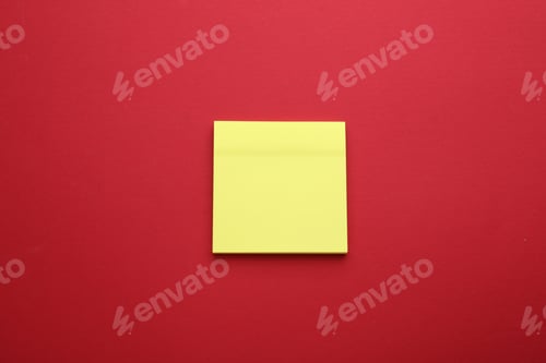 Preview: Paper note on red background, top view